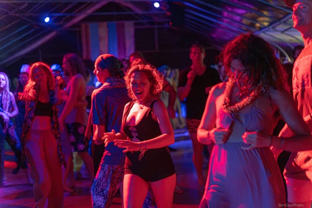 a group of women with happy expressions on their faces dancing at a movement event