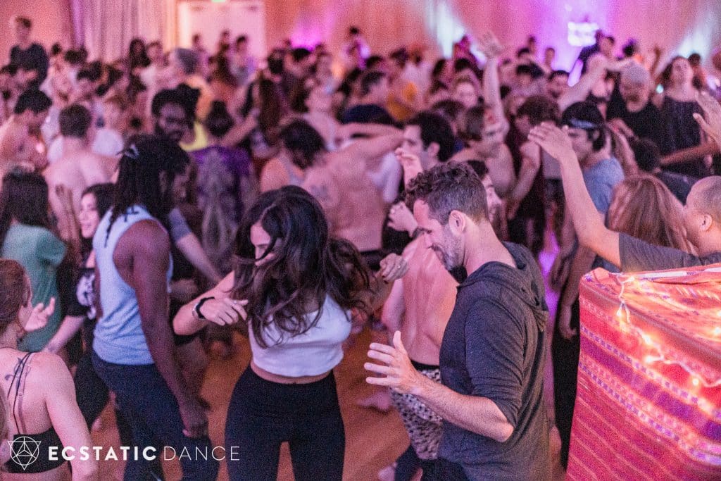 group of people dancing at an ecstatic dance la event