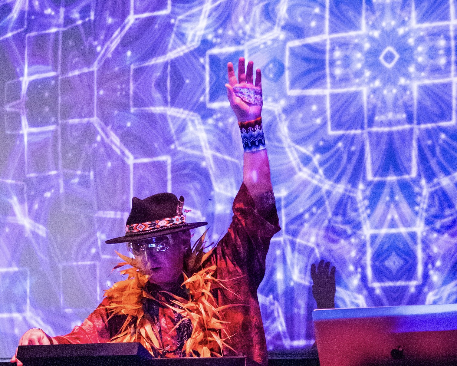 jami deva headshot, while djing at an event